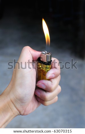 Hand with lighter : Arson concept
