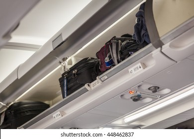 2,142 Airplane luggage compartment Images, Stock Photos & Vectors ...