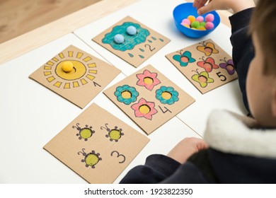 Hand Made Children Home Activity From Cardboard And Pom Poms. Early Education, Montessori Methodology. Implement To Develop Fine Motoric Skills, Logical Thinking Learn Counting.