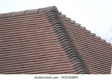 Hand Made Clay Tiles On A Hip Roof