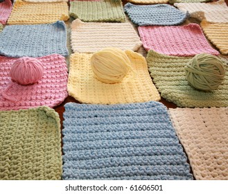 Hand Made Crochet Squares And Yarn Ready To Be Sewn Into A Baby Blanket