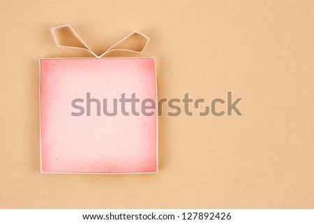Hand made empty gift box, textured paper as background. Free space for text. Greeting card