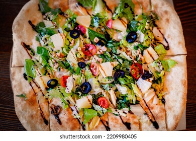 Hand Made Fresh Organic Vegan Pizza On Wooden Table