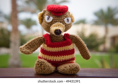 Hand Made Knitten Toy Bear Front Of Palm