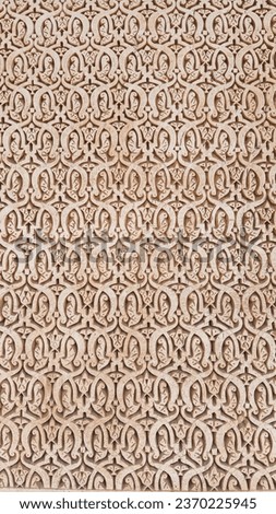 Hand made patterns engraved on plaster wall. Moroccan traditional plaster work. Abstract ornamented plaster wall textured background. Islamic patterns on plaster wall.