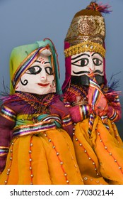 Hand made puppets attached to string, King and queen in Rajasthan India. Dolls men and women face wearing traditional dress saree or sari, Kurta  for plays, dance for Dussehra, Dasara, Diwali festival