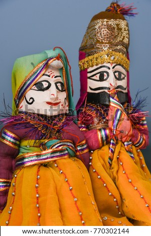 Hand made puppets attached to string, King and queen in Rajasthan India. Dolls men and women face wearing traditional dress saree or sari, Kurta  for plays, dance for Dussehra, Dasara, Diwali festival