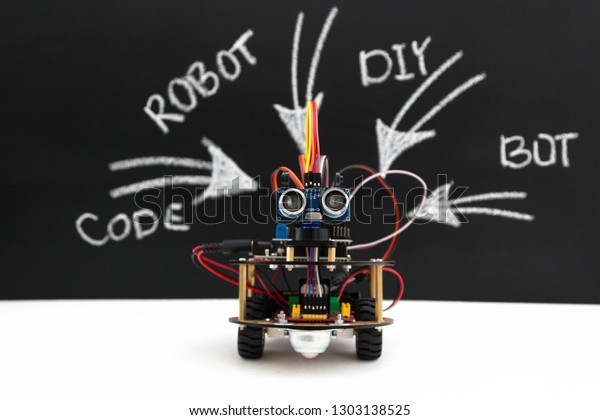 Hand made robot working\
on the arduino platform. White background. Free space for text.\
STEM education for children and teenagers, robotics and\
electronics. DIY. AI.\
STEAM.