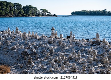 Hand made rock formation on the gravel shore at the town of Rovinj, Croatia