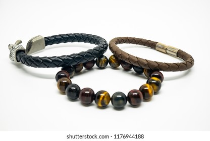 Hand made stone bead bracelets and leather bracelets on white background