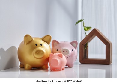 Hand Made Wooden House With With Piggy Bak Near Window