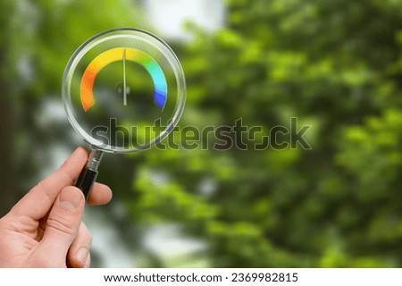 hand with a magnifying glass with air quality text
