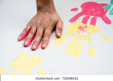 Hand Make A Trace Colorful Symbol On White Paper Background