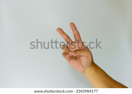 Hand makes a two fingers up gesture. Welcome gesture


