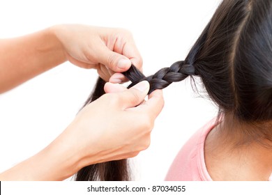 Hand making braid for little girl - Powered by Shutterstock