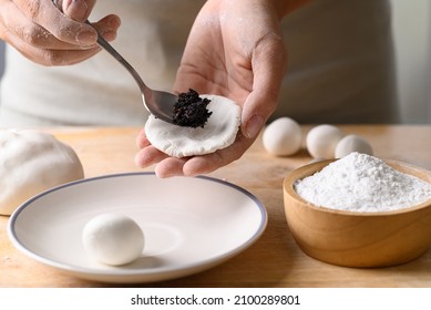 Hand Making Tangyuan, Chinese Dessert Made Of Ball Glutinous Rice Flour And Filled With Black Sesame