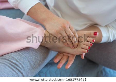 Hand making thai feet massage. Alternative medicine and thai massage concept 
