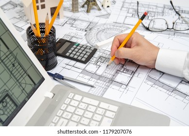 The Hand Of A Male Architect Drawing A Design Using A Pencil