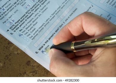 Hand Of A Man Answering The United States Census 2010. He's Marking 