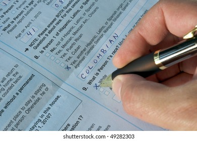 Hand Of A Man Answering The United States Census 2010. He's Marking 