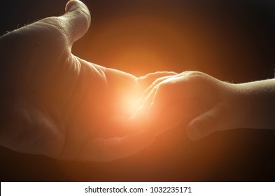 hand of man and child,God's help