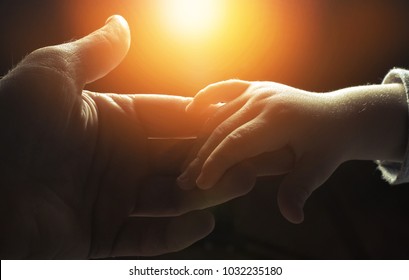 hand of man and child,God's help - Shutterstock ID 1032235180