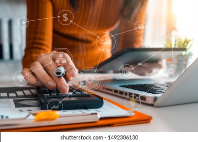 Hand man doing finances and calculate on desk about cost at home office. - Shutterstock ID 1492306130