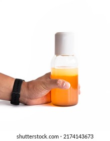 Hand of man holding Thai Boxing Liniment (Namman Muay) use for massage to relieve muscle. - Shutterstock ID 2174143673