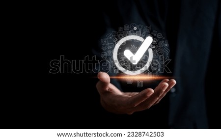 Hand man holding tick or check mark correct sign for quality standards control checklist, Business corporate approve verification project.	
