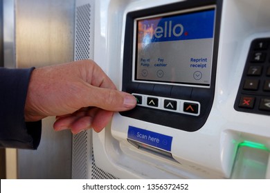 Hand Of Man Press Button, Pay At Pump On Automatic Self Service Machine At Petrol Station.