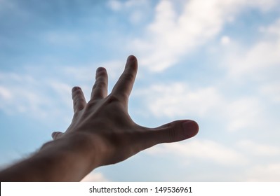 Hand Of A Man Reaching To Towards Sky. 