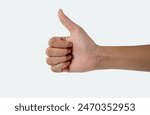 Hand of man showing thumb-up gesture on white background.