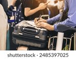 Hand of man traveler using pen filling immigration form at airport. Male tourist hand filling Immigration form on flight. Man passenger write immigration card. A man is writing, signing on a paper.