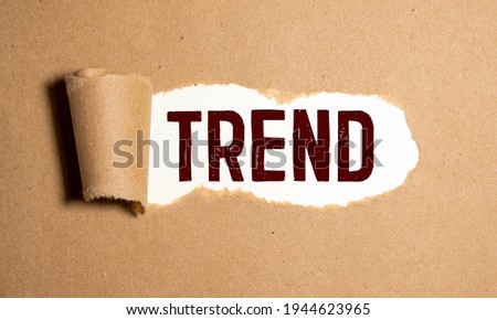 hand man try to complete the Trend word on wooden cube, Trend concept.