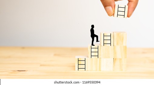 Hand Man Try To Put The Next Stair On The Wooden Dice To The Man For Next Step ,chance, Job ,business,success ,project ,goal