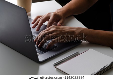 hand of man typing labtop for business concept