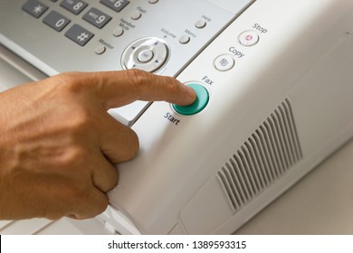 Hand man are using a fax machine in the office Business concept  - Shutterstock ID 1389593315