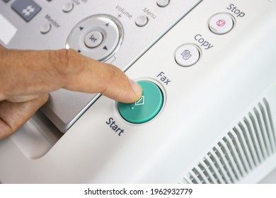 hand man are using a fax machine in the office, equipment for data transmission.