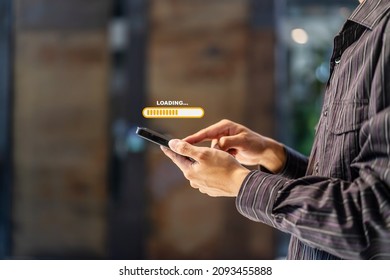 Hand man using mobile smartphone for download application and waiting to loading. Loading icon on screen. businessman downloading digital business data form website and cloud to smartphone