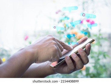 Hand man using smart phone with Social media and flower garden blur background. Social media and digital online concept. The concept of living on vacation and playing social media.  - Powered by Shutterstock