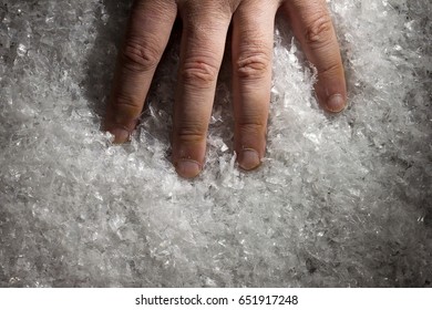 Hand Of A Man In White Artificial Snow