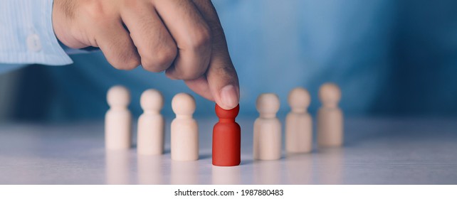 Hand of manager management human resource with recruitment and skill employee leader for corporate success, development and growth of leadership with unique, symbols of metaphor, business concept. - Shutterstock ID 1987880483