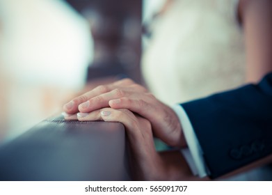 Hand in hand, the man's hand holding the girl's hand - Shutterstock ID 565091707