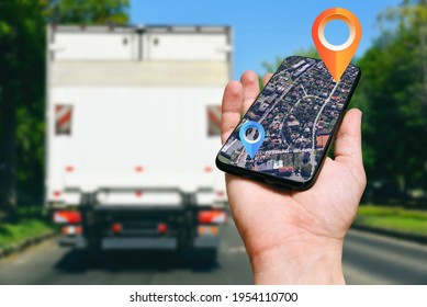 Hand With Map And Navigation. Search For Delivery Address. Delivery Concept GPS Navigation Or Route.