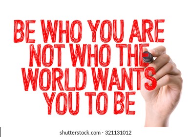 Hand with marker writing: Be Who You Are Not Who The World Wants You To Be