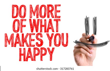 Hand with marker writing: Do More of What Makes You Happy