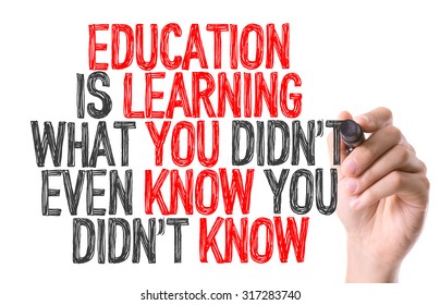 Hand with marker writing: Education is Learning What You Didn't Even Know You Didn't Know