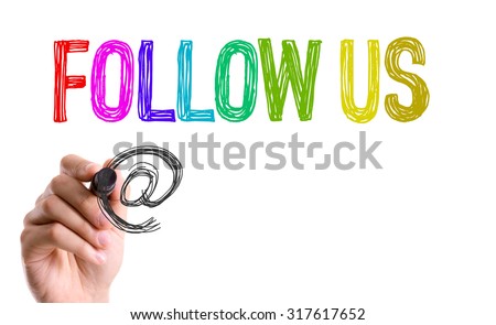 Hand with marker writing: Follow Us