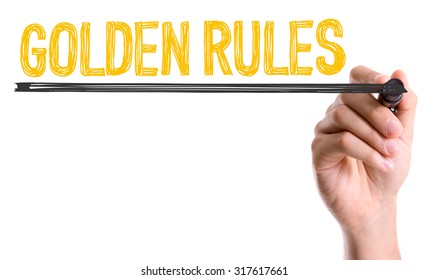 Hand with marker writing: Golden Rules - Shutterstock ID 317617661