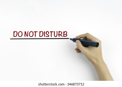 Hand With Marker Writing The Text  Do Not Disturb